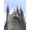 This is a photograph of an old church in Ireland. Beautiful stonework with an upward camera angle focusing on the steeples. Great for church bulletin use!